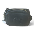 Superlative Online black pebbled leather camera bag with a textured finish, top-zip closure, and embossed logo detail.