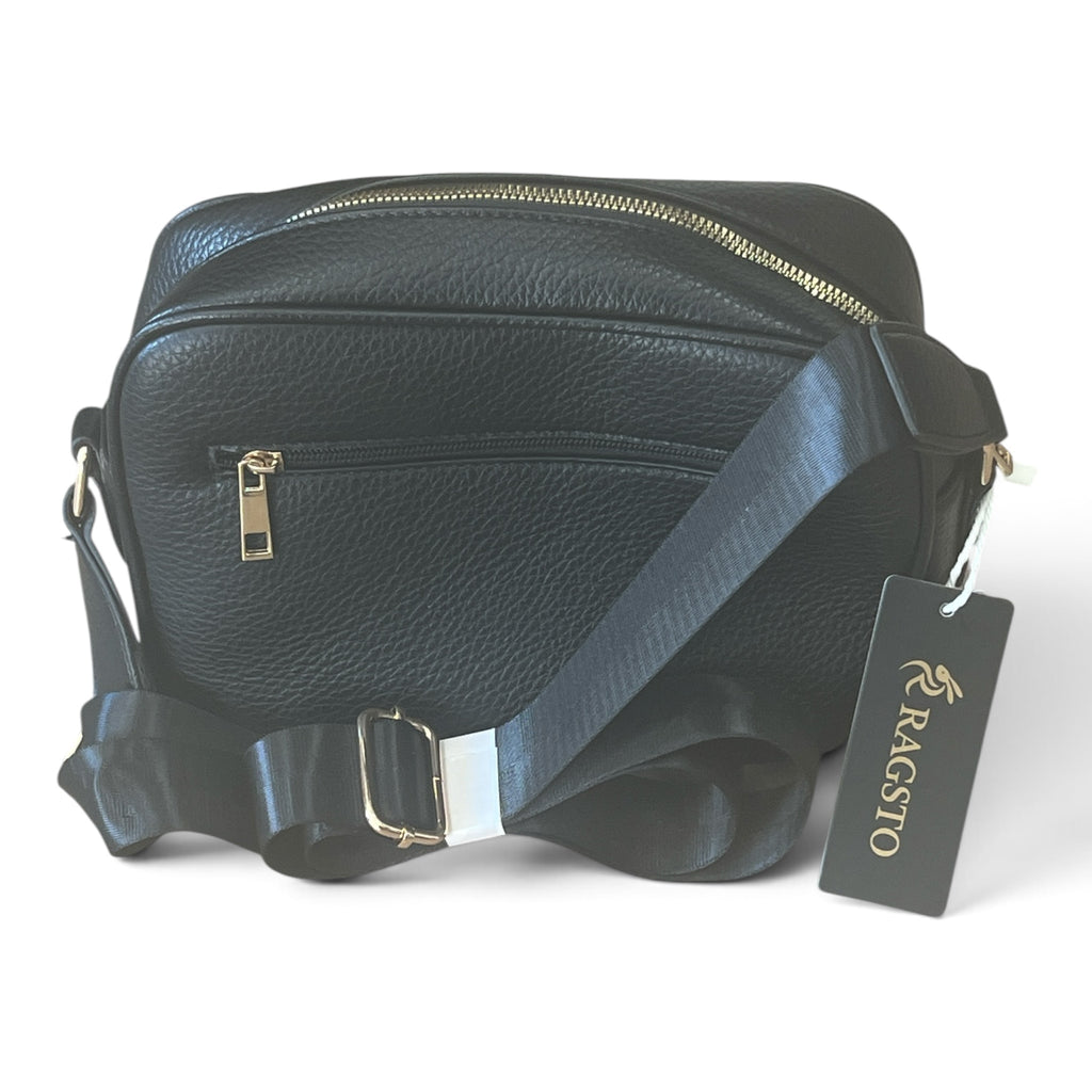 Superlative Online RAGSTO black pebbled leather camera bag with wide webbing strap and gold zip hardware