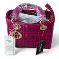 Superlative Online fuchsia pink vegan leather handbag with quilted heart pattern and gold-tone hardware charm