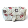 Superlative Online white quilted leather shoulder bag with red and berry kiss-print pattern and silver chain strap